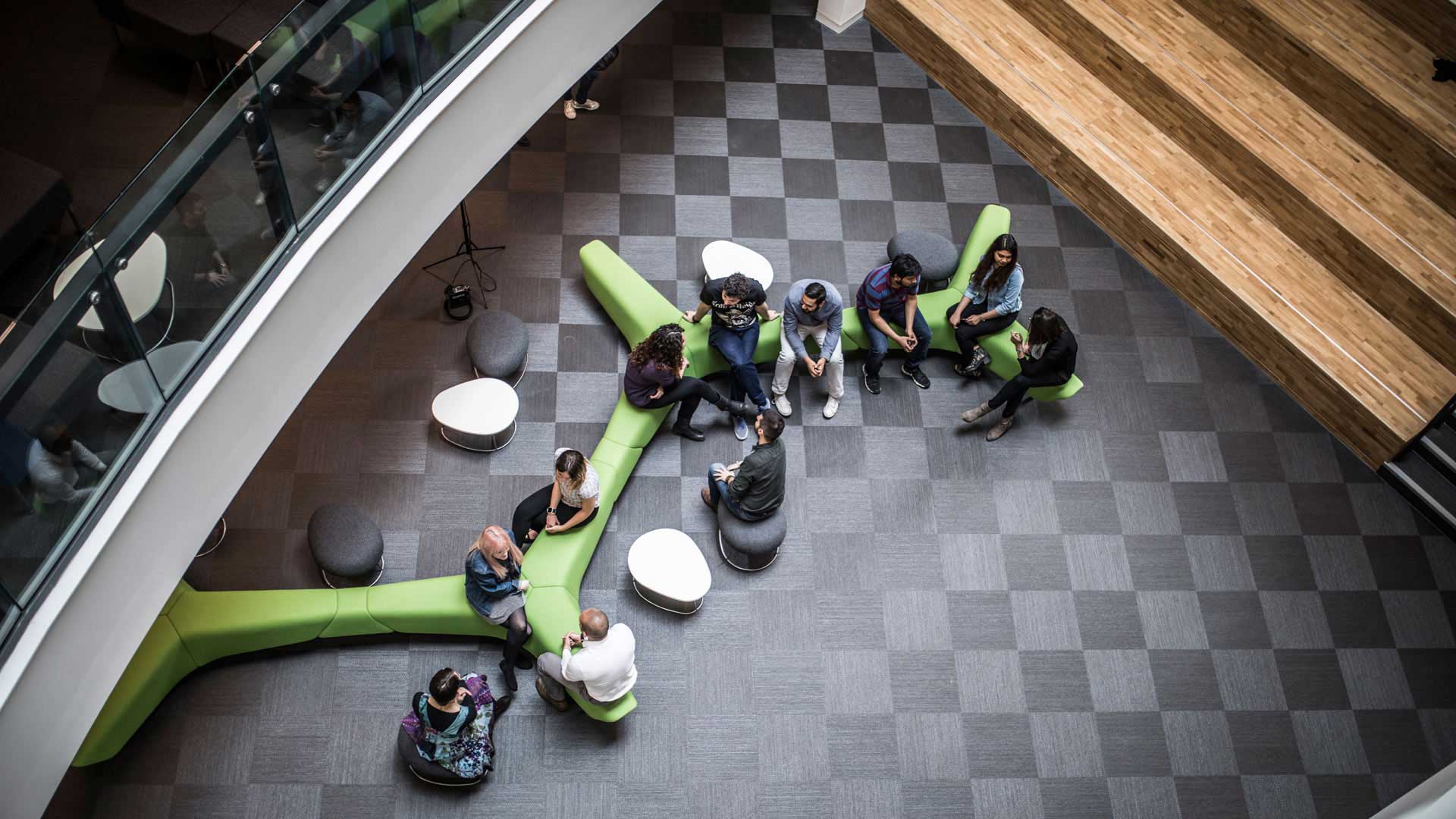Students sitting at a social breakout area in The Oastler Building