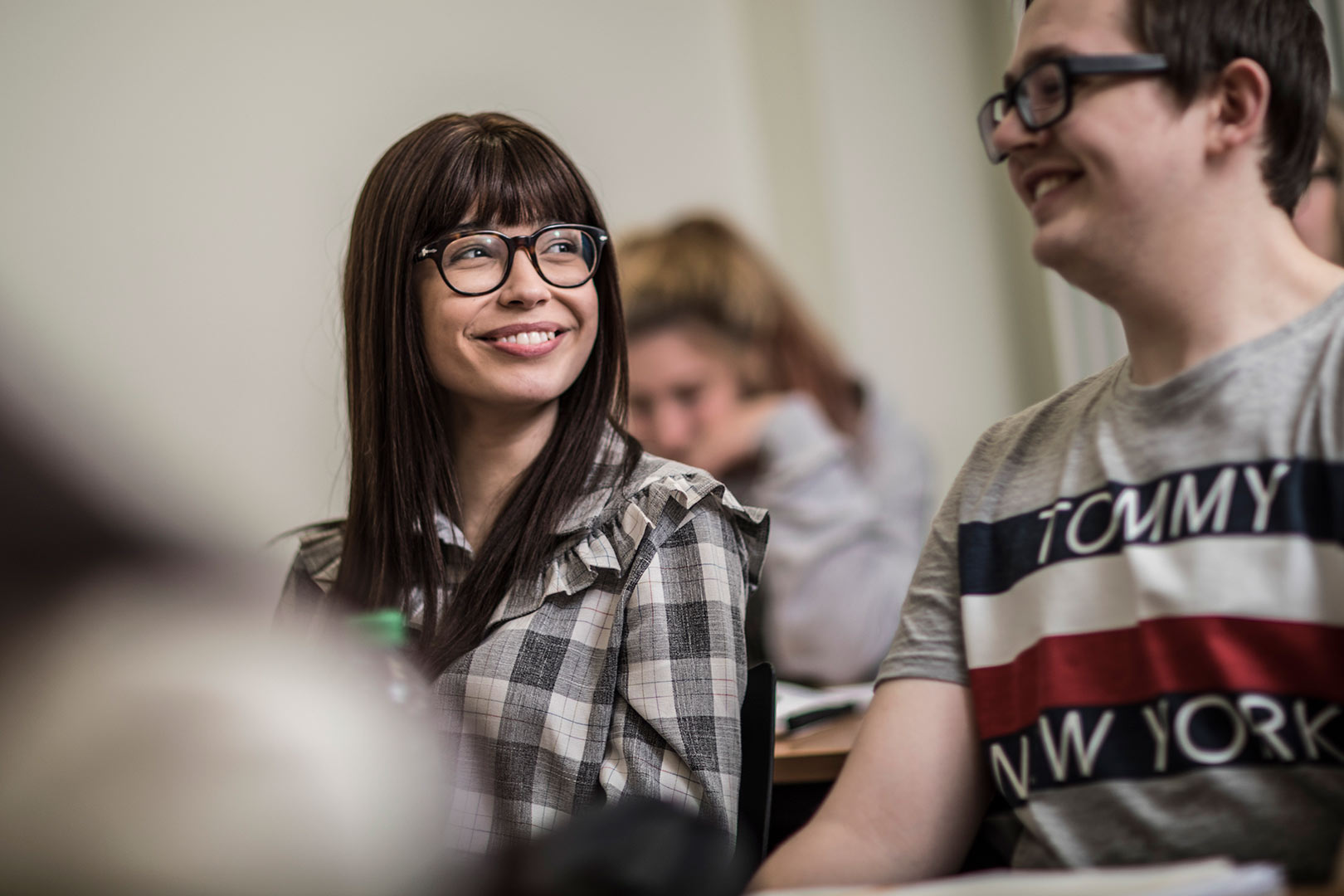 Students smiling in a lecture